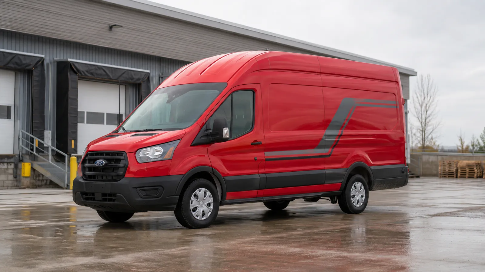 A red commercial van being detailed in the rain